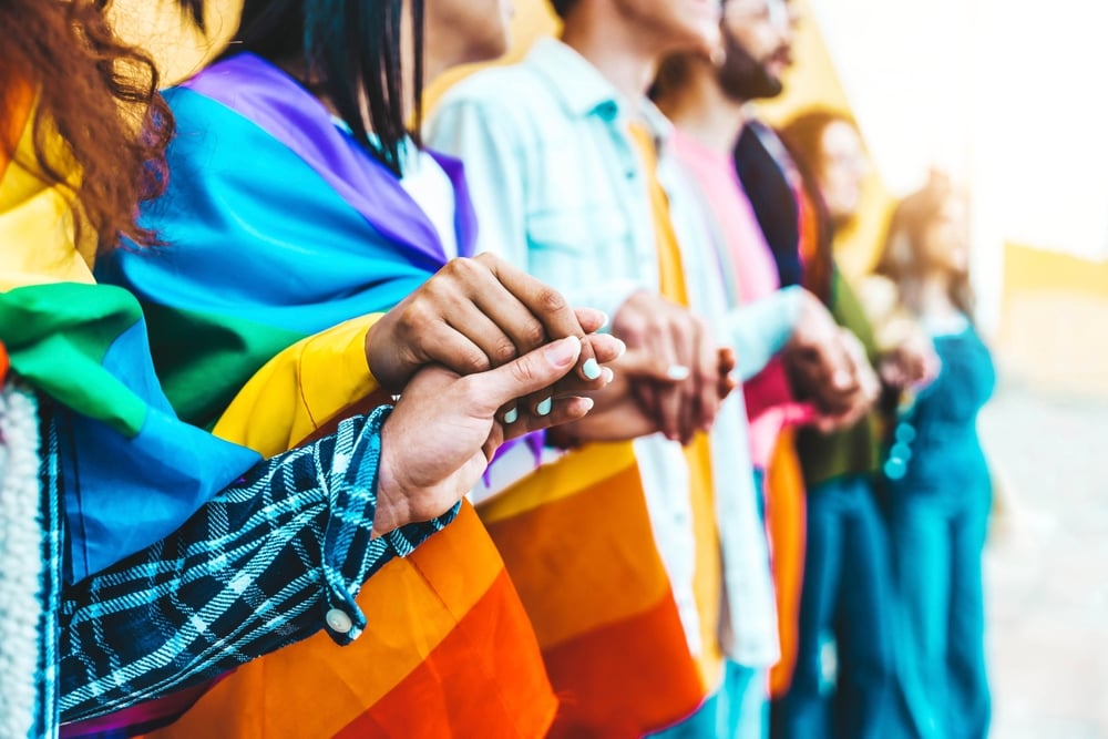 LBGT people holding hands